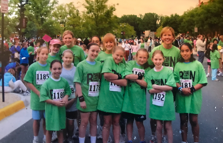 Group of girls posing for a picture at the 5K.